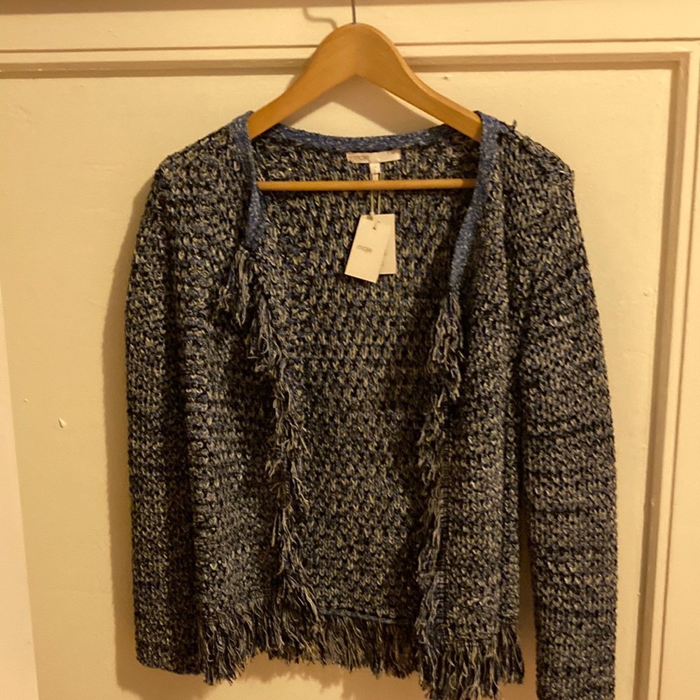 three-quarter length sleeves, textured with metallic detailing, fringed trims.